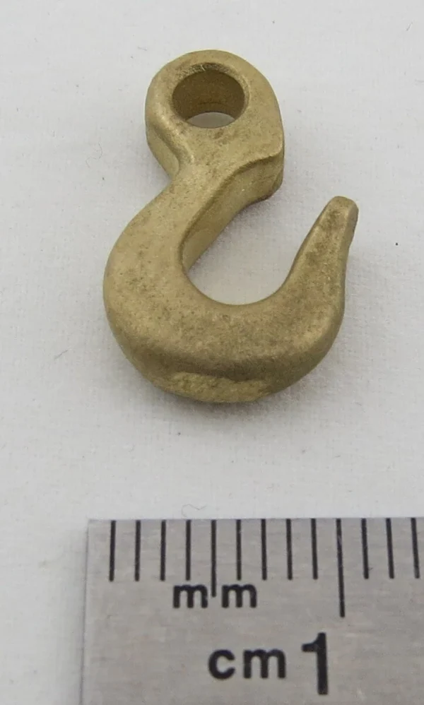 1 Messing-Feinguss-Haken. Mit Anschlag- Öse. Gesamthöhe 1